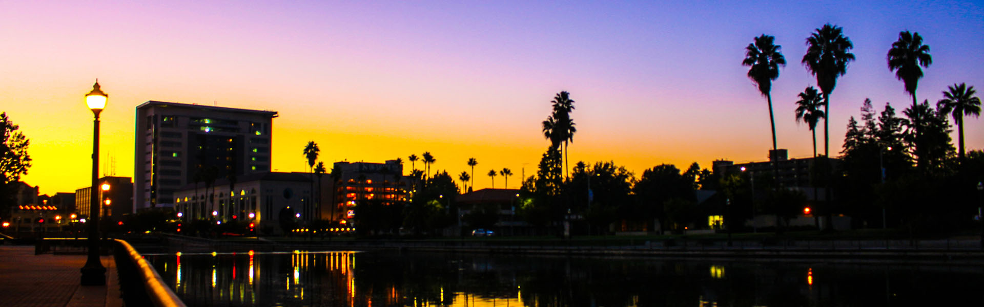 Neon color image of a band playing and people singing along